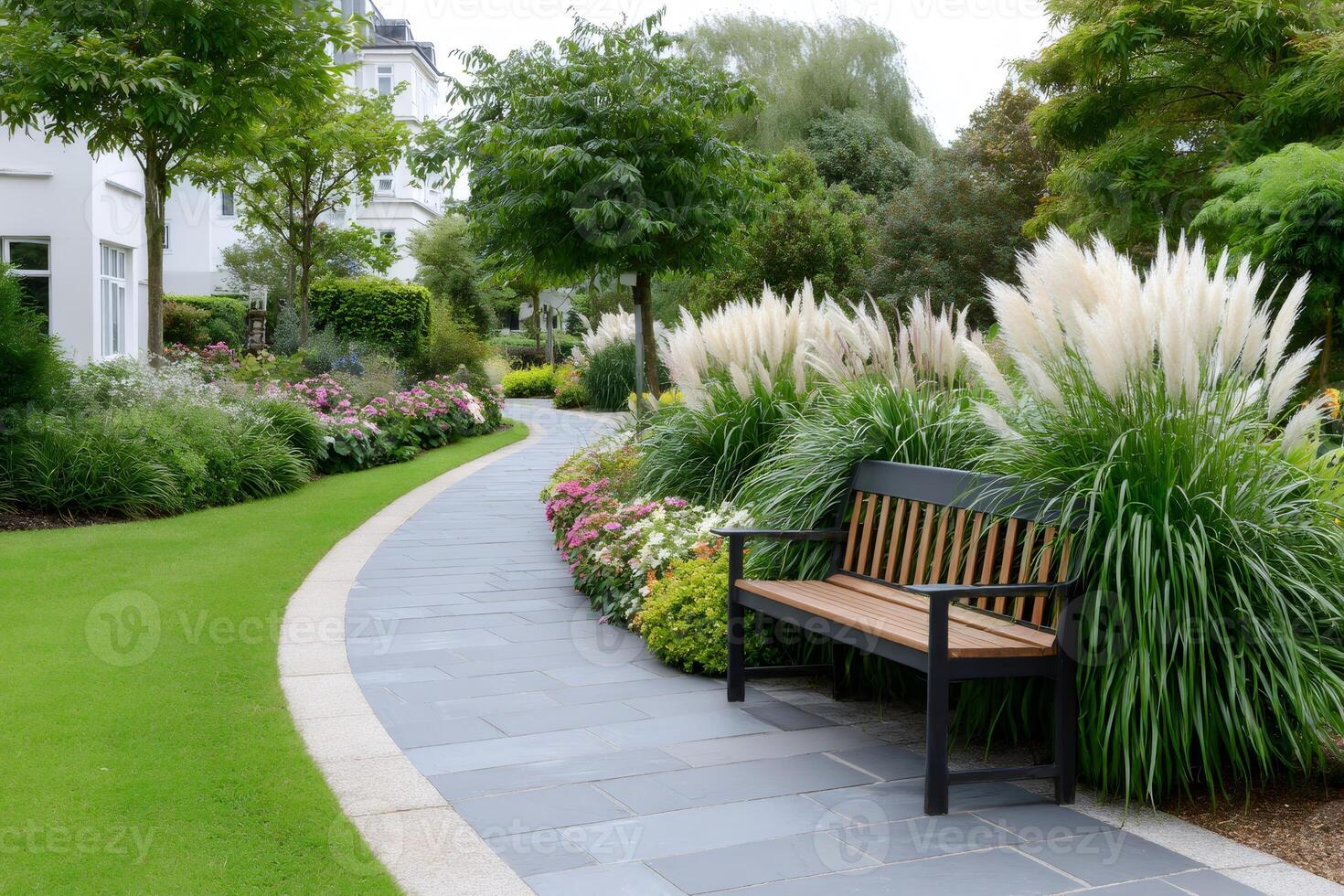 Relaxing bench inviting to sit and enjoy the beautiful garden photo
