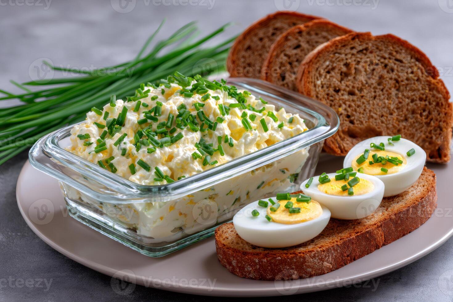 Fresh egg salad with chives and rye bread for breakfast photo