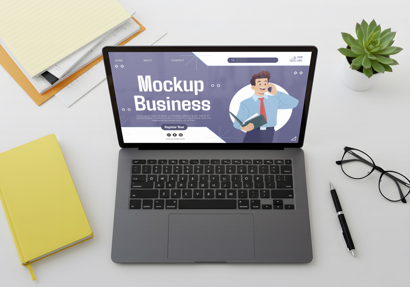 A laptop displays a business mockup website featuring a man on a phone call psd