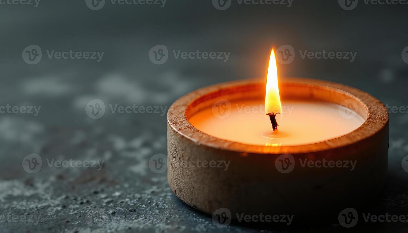 Burning candle in a decorative holder. Relaxing flame for meditation, aromatherapy, and a cozy home atmosphere. Warm light for spiritual concept. photo