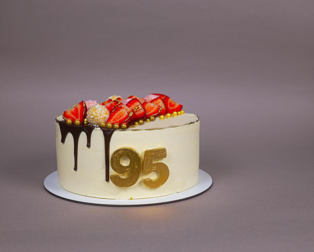 The handmade cake was specially crafted for a 95th birthday celebration. Its elegant design and detailed decorations highlight the significance photo