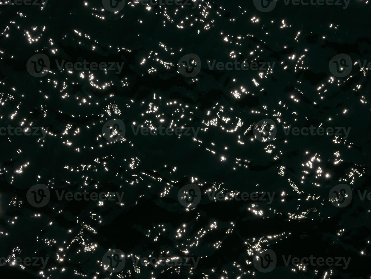 Water surface contrast top view. Sun glare on water black and white edit. Background abstracted wallpaper texture photo