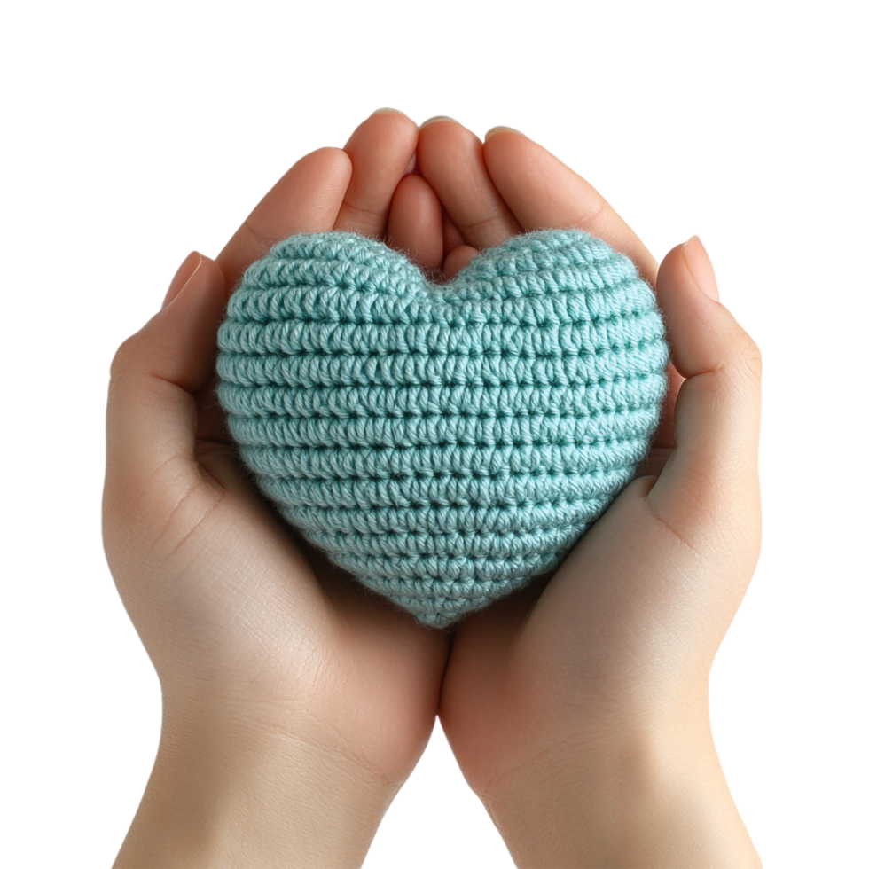 Hand holding a heart shaped crochet on a transparent background png