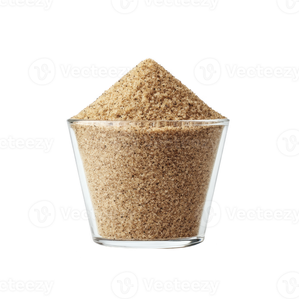 Clear glass filled with brown sugar, showcasing its granular texture and rich color, is set against plain background. sugar is heaped above rim, emphasizing its abundance png