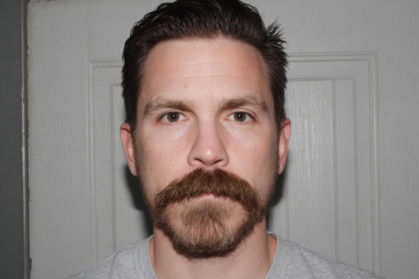 Portrait of a Man with a Well Groomed Mustache and Beard photo