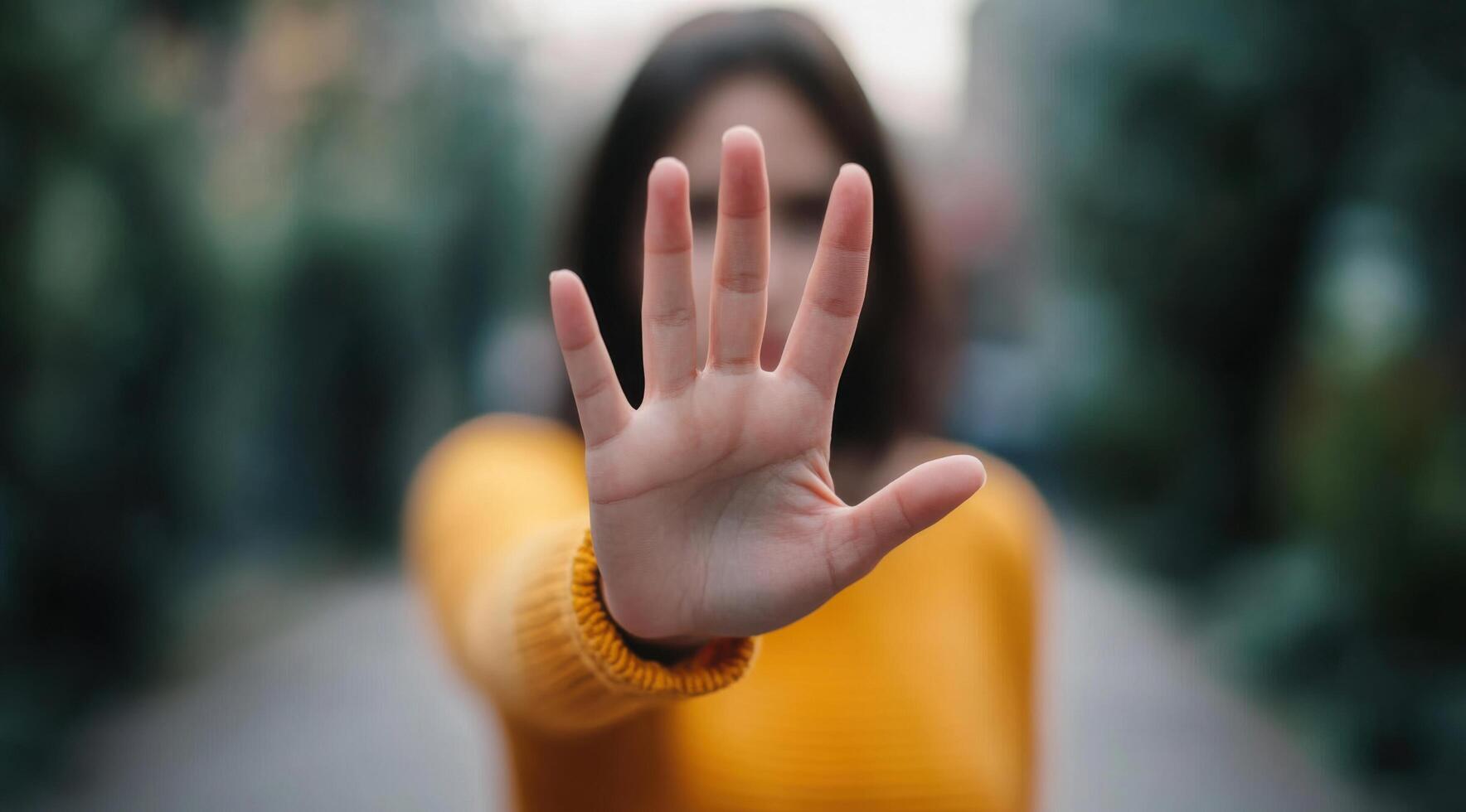 A Woman's Hand in a Stop Gesture A Powerful Image of Refusal, Rejection, and Setting Boundaries. This image conveys strength and r photo