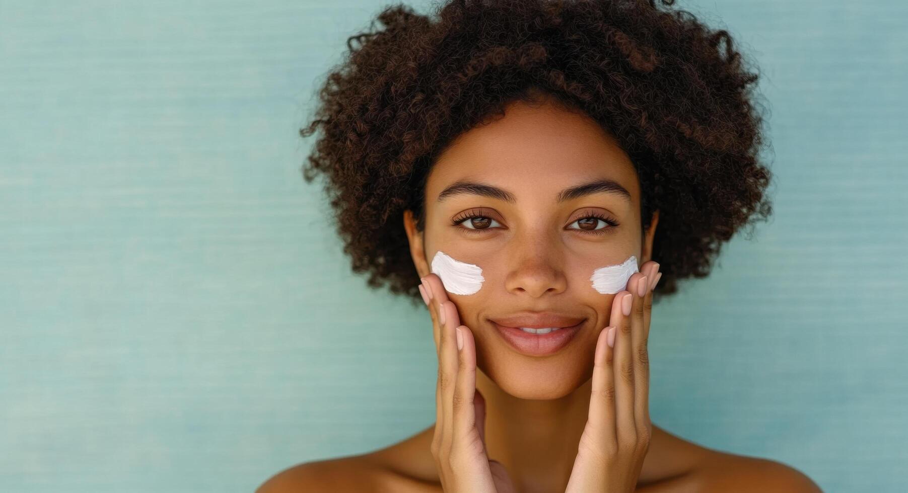 A Stunning Portrait of a Young Woman Applying Moisturizing Cream to Her Face, Exuding Natural Beauty and Healthy Skincare Routine photo