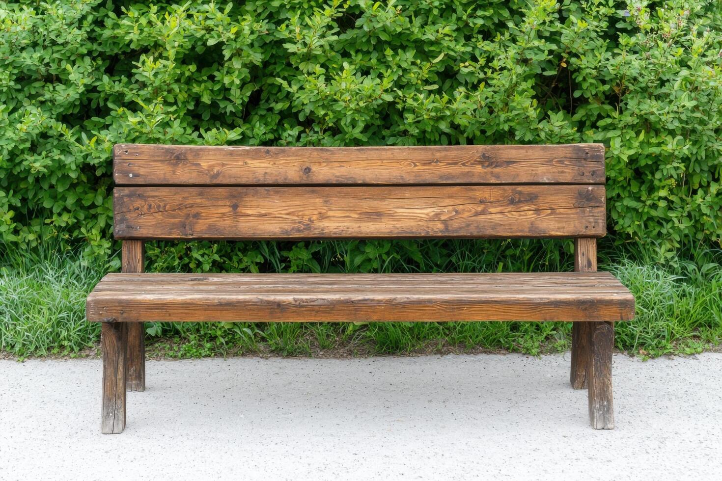 Rustic Wooden Park Bench Against Lush Greenery A Serene Outdoor Sitting Space. Perfect for Relaxation and Enjoying Nature's Beauty photo
