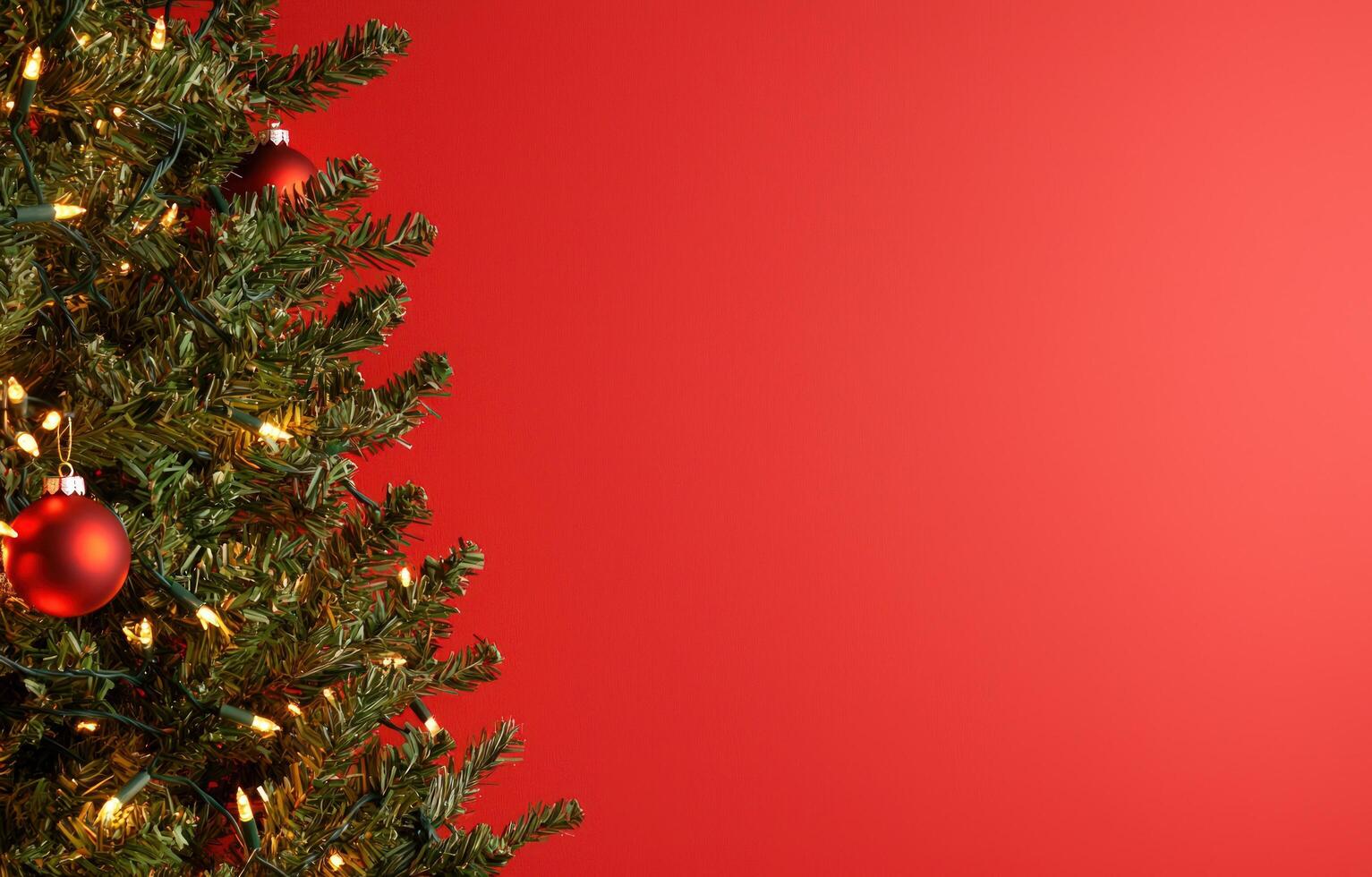 Christmas tree with ornaments and lights on red background for holiday greetings photo