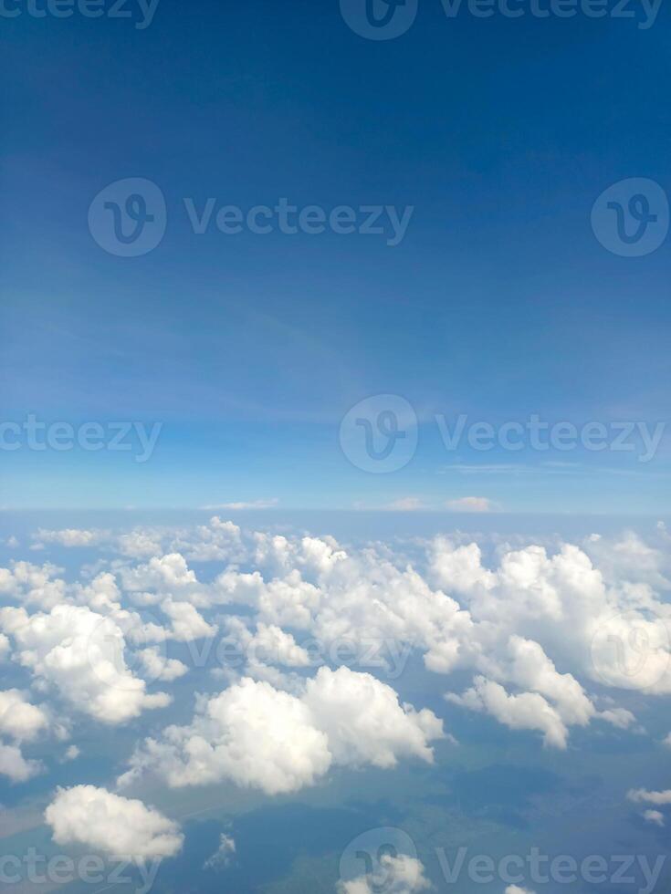 Beautiful and fluffy white cumulus clouds in the blue sky photo