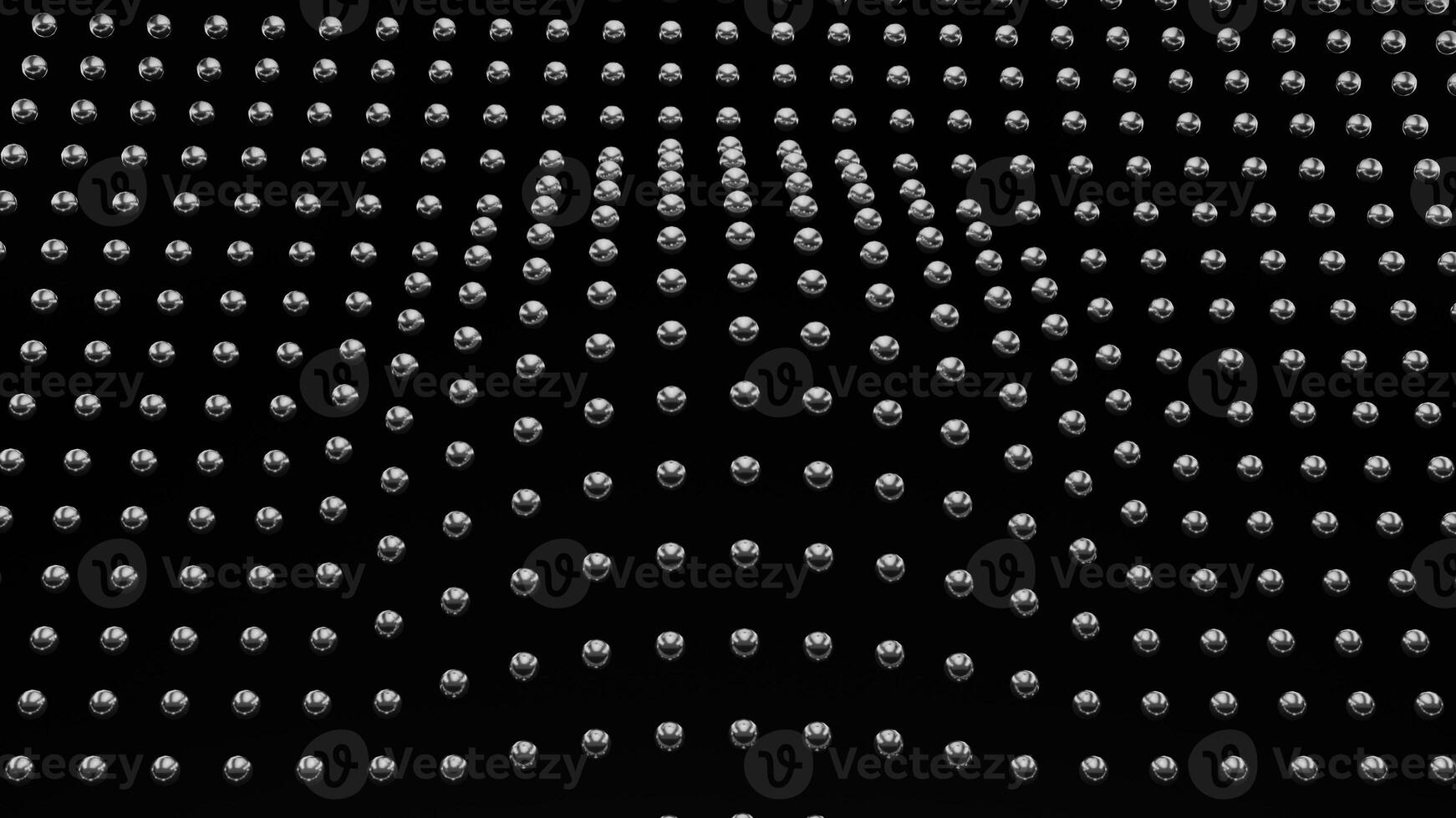 A black and white photo of a wall with many white dots