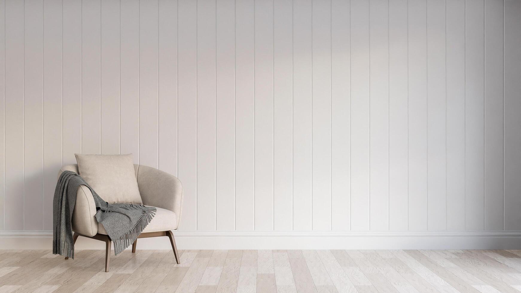 A chair in an empty room with a wall photo