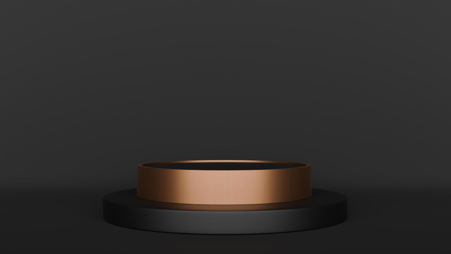 A black and gold ring on a black surface photo
