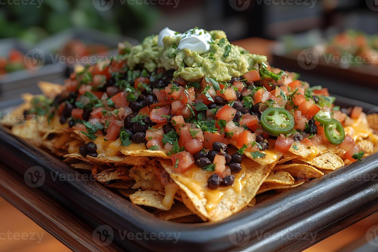 Delicious Loaded Nachos with Guacamole and Sour Cream - Perfect for Mexican Fiesta or Party Snack Ideas photo