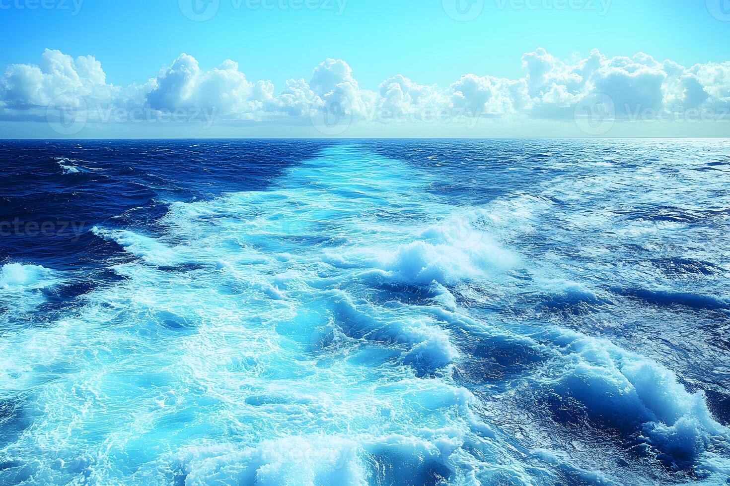 Expansive Ocean Horizon and Foamy Waves Under Vibrant Blue Sky photo