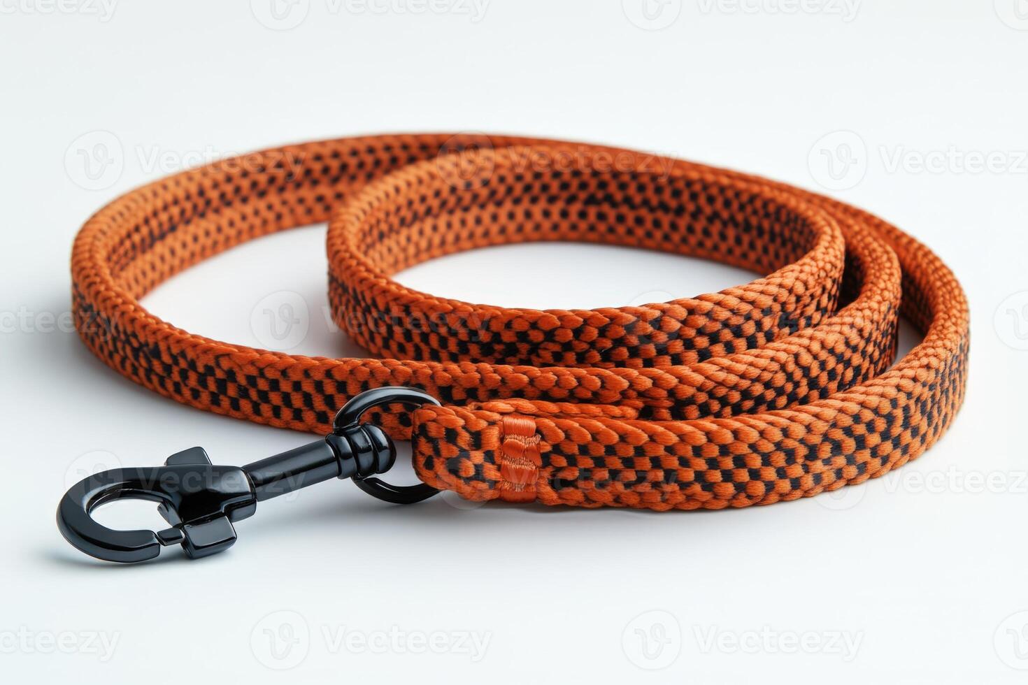 An orange and black dog leash with a black hook photo
