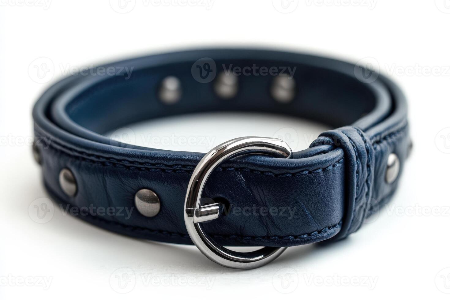 A blue leather dog collar with metal rivets photo