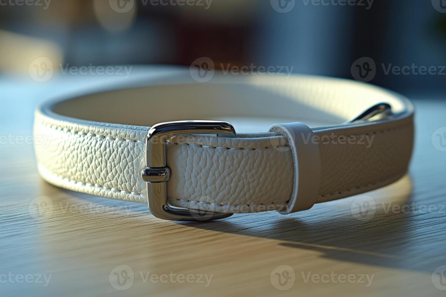A white leather dog collar with a buckle photo
