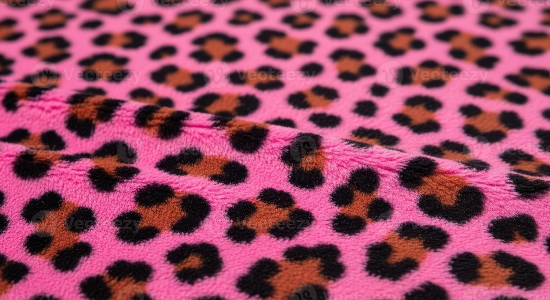 Vibrant pink plush faux fur fabric with bold leopard print pattern texture photo