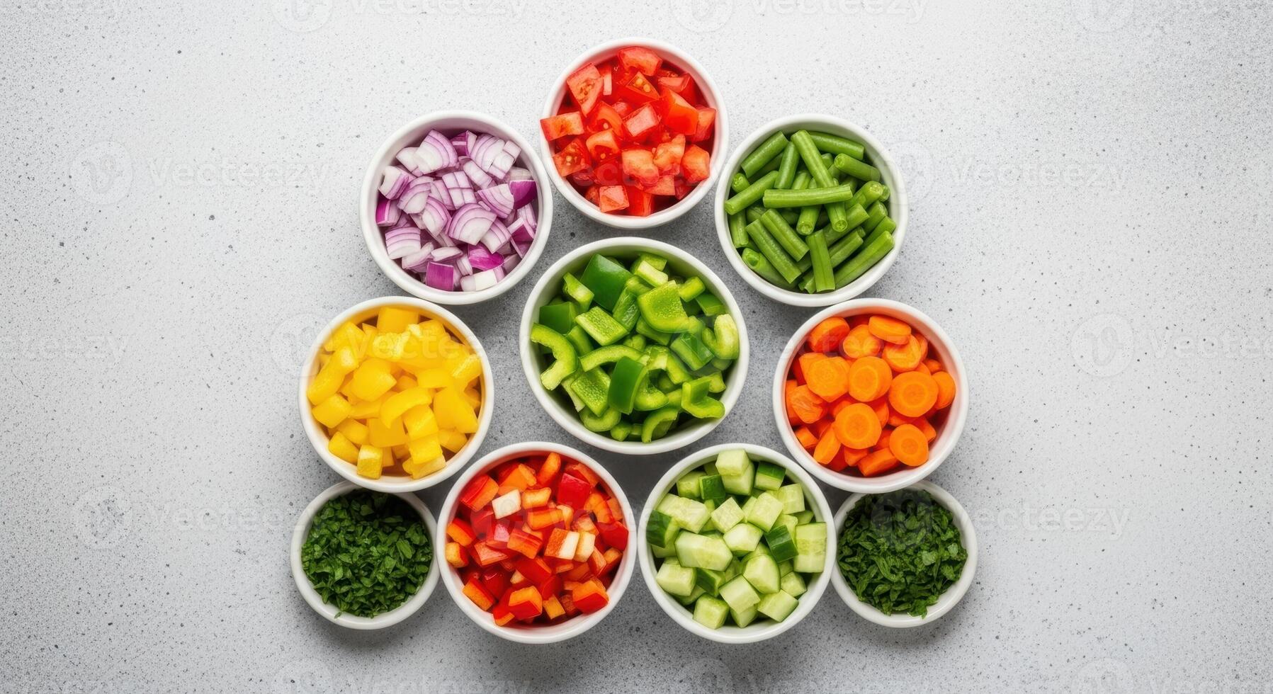 Nine white bowls filled with various colorful chopped fresh vegetables and herbs, top view. photo
