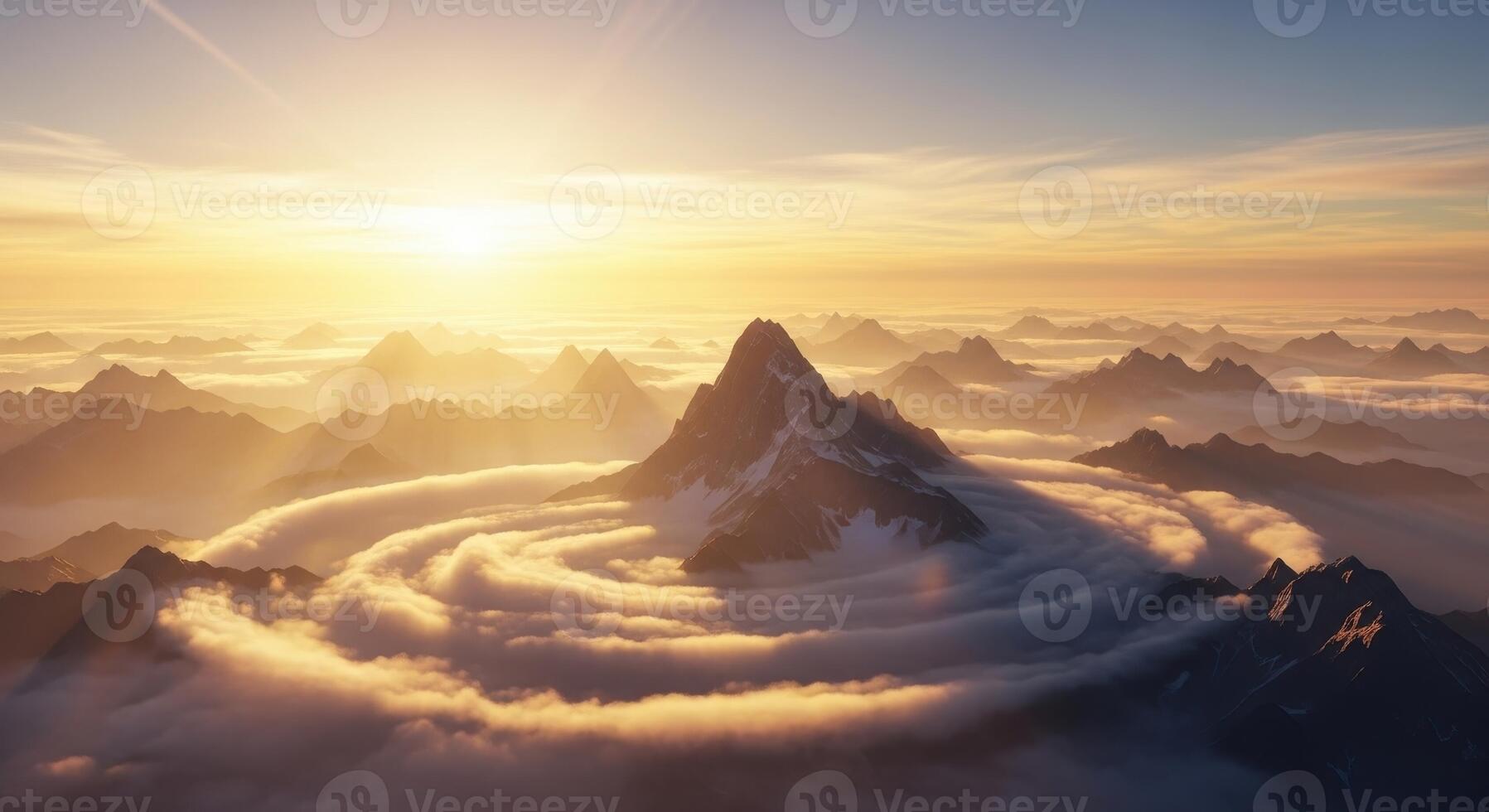 Golden sunrise over a majestic mountain range with swirling clouds photo