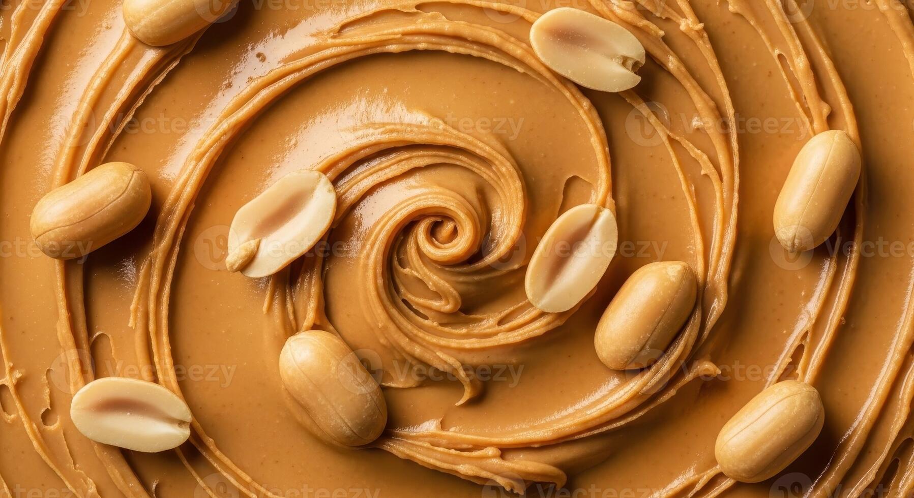 Delicious creamy peanut butter swirl with whole and split peanuts, top view photo