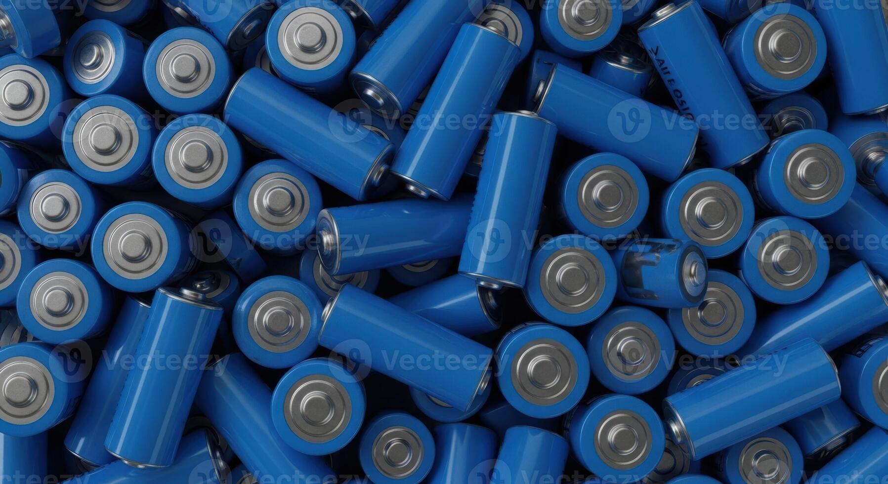 Pile of blue cylindrical batteries from an overhead view, symbolizing energy and power. photo