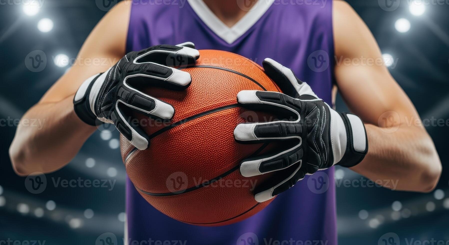Male basketball player in a purple jersey holding a basketball on an indoor court photo