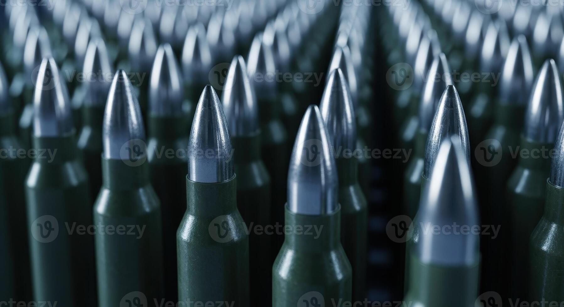 Rows of military rifle bullets with metallic tips and green casings, close up view photo