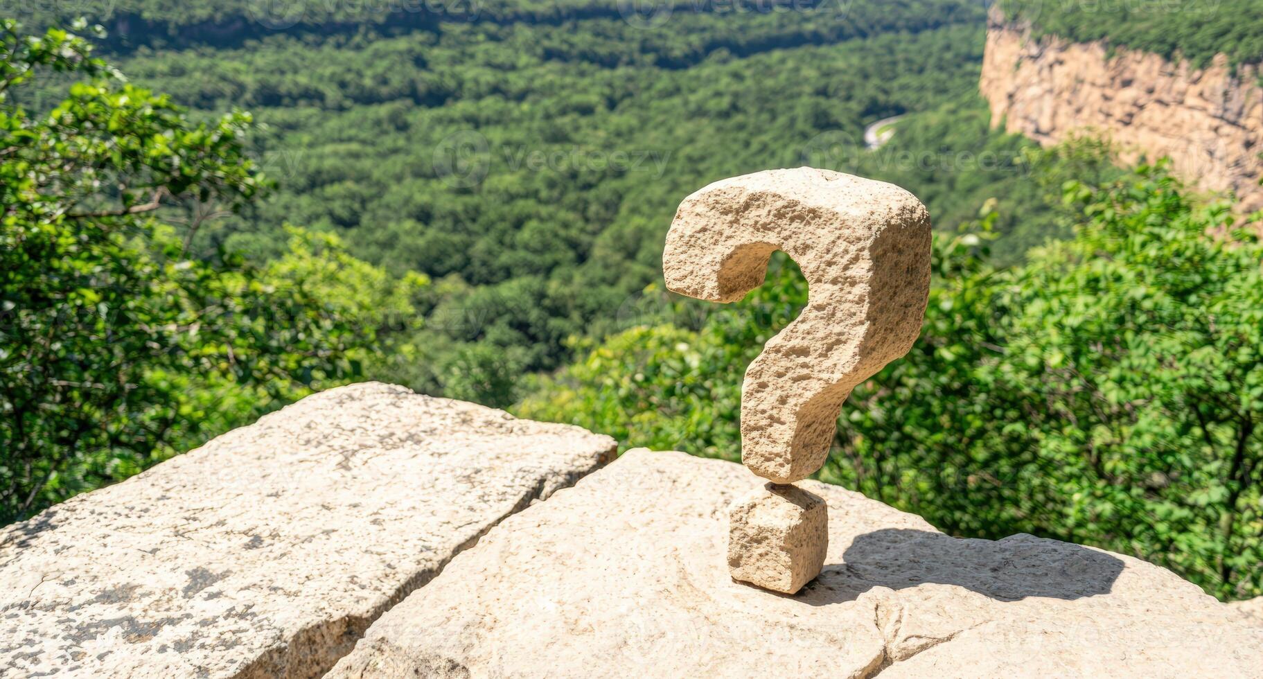 Stone question mark perched on a rock ledge photo