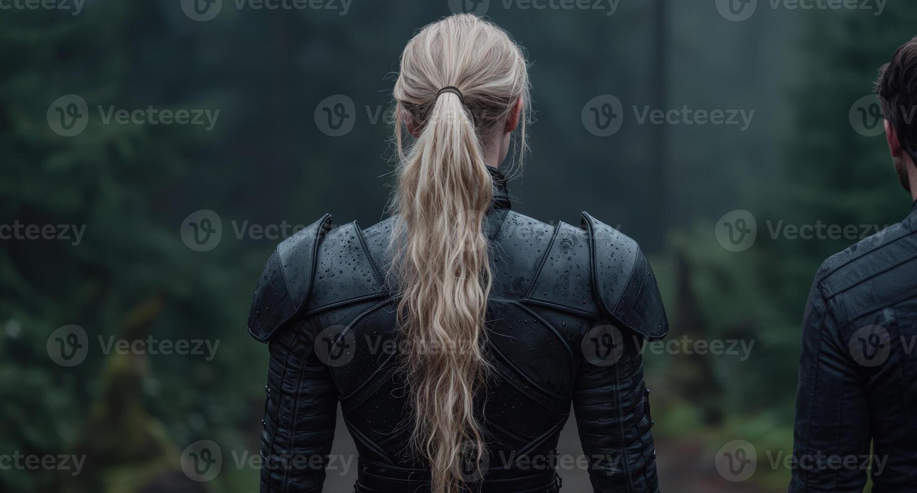 Woman with long blonde hair wearing dark armor photo