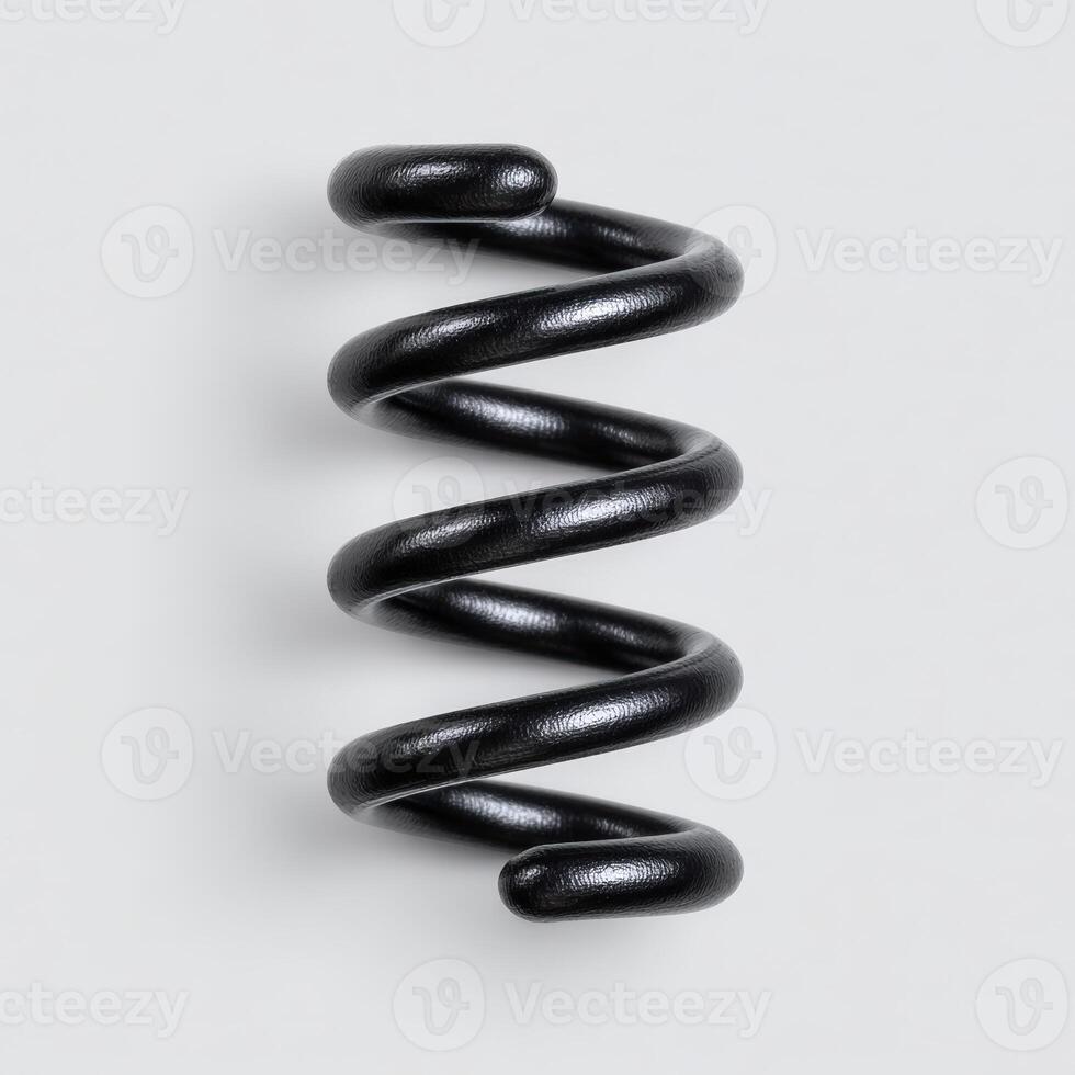 Glossy black coiled spring on a white background photo