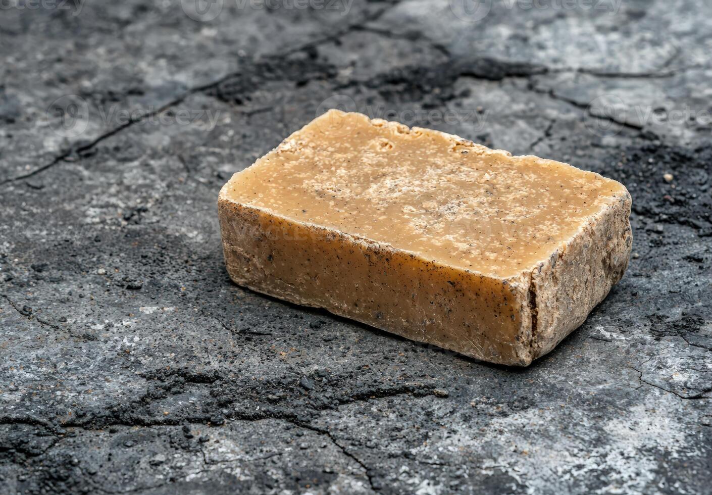 Rustic bar of handmade soap on a textured surface photo