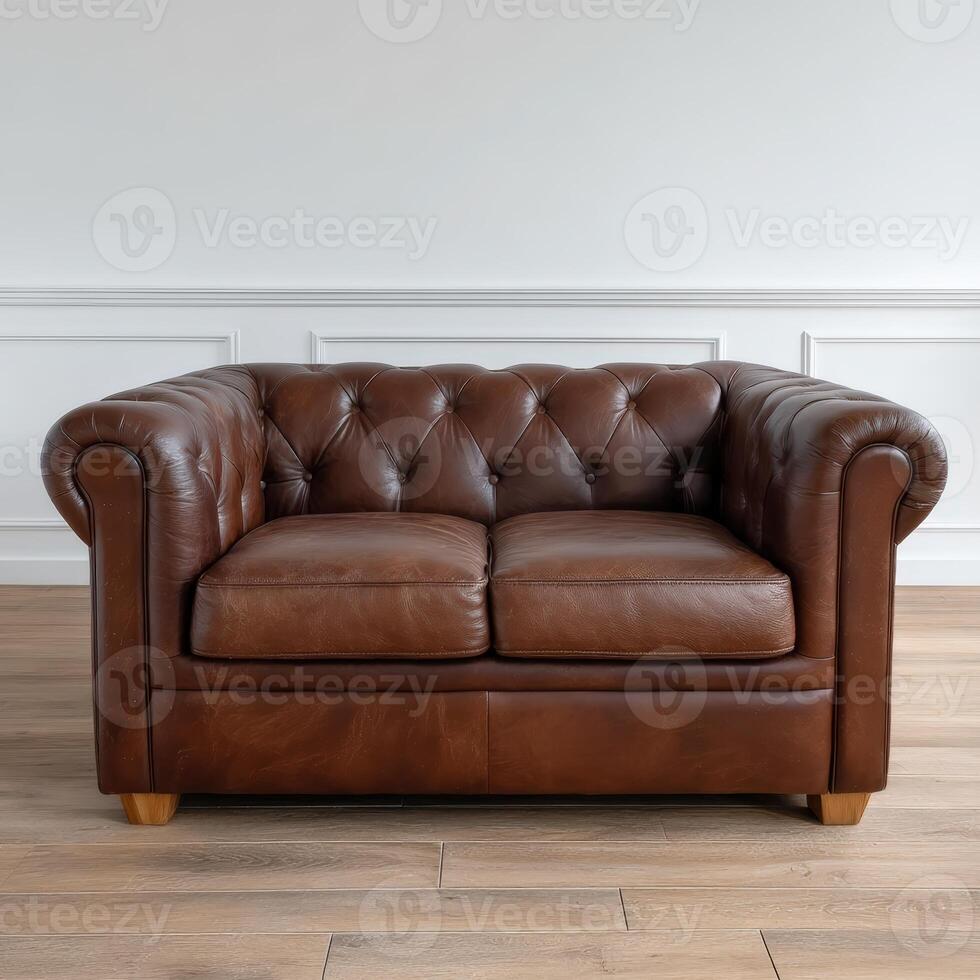 Elegant brown leather chesterfield sofa in bright living room photo