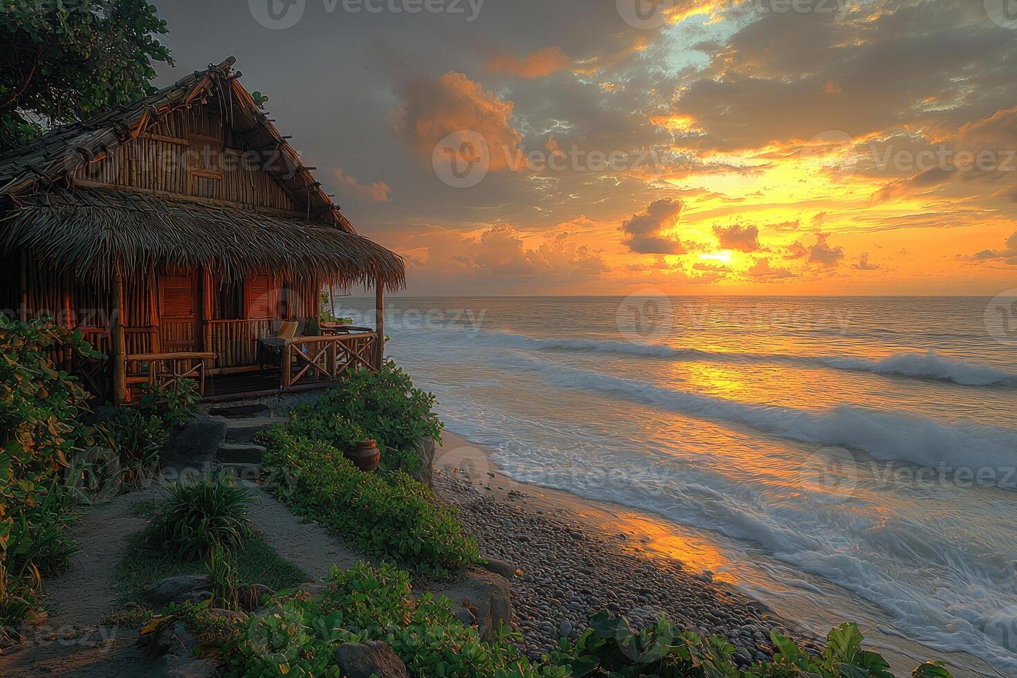 A coastal hut enjoys the sunrise over the endless ocean water photo