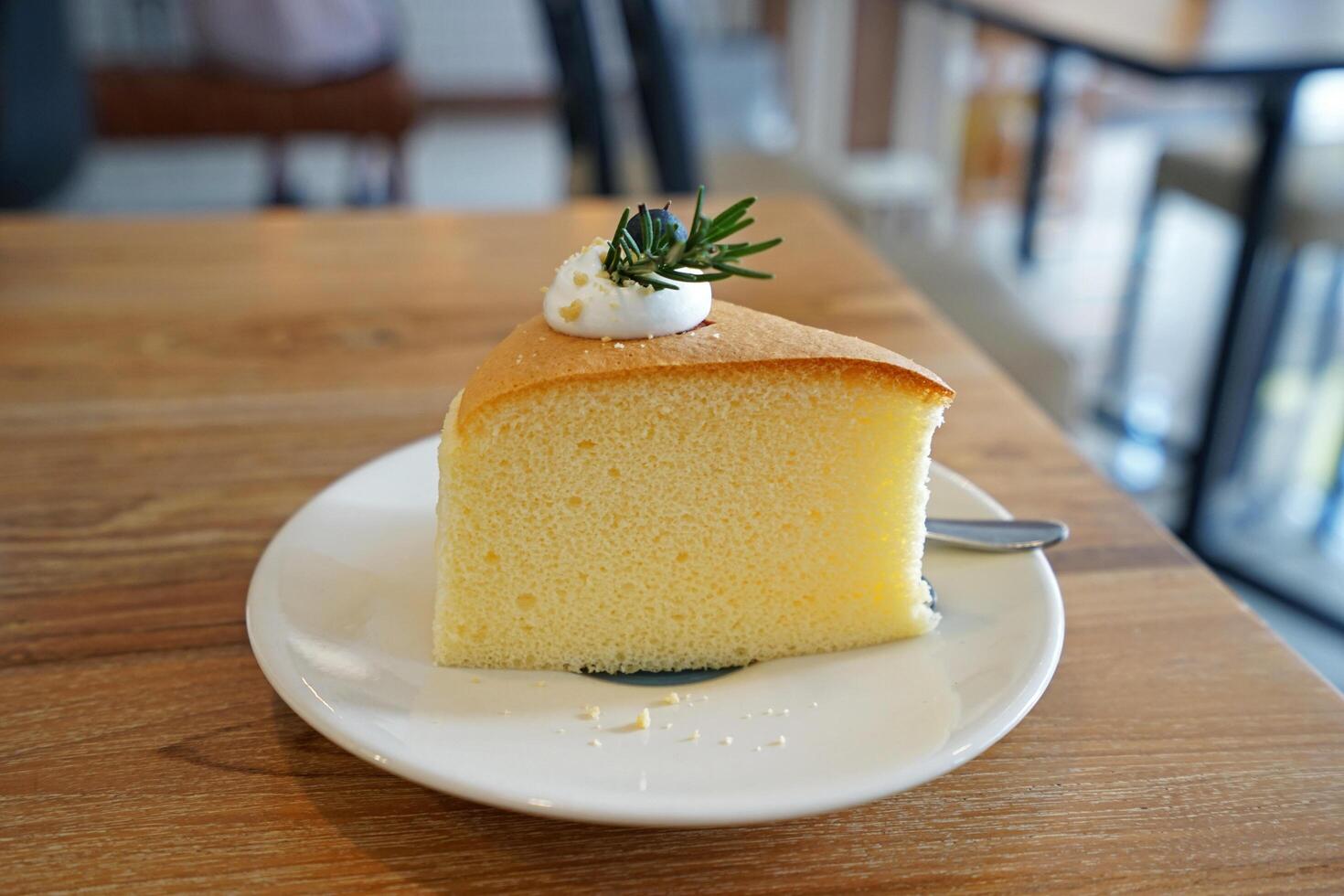 Close up dish of butter cake with whipped cream photo