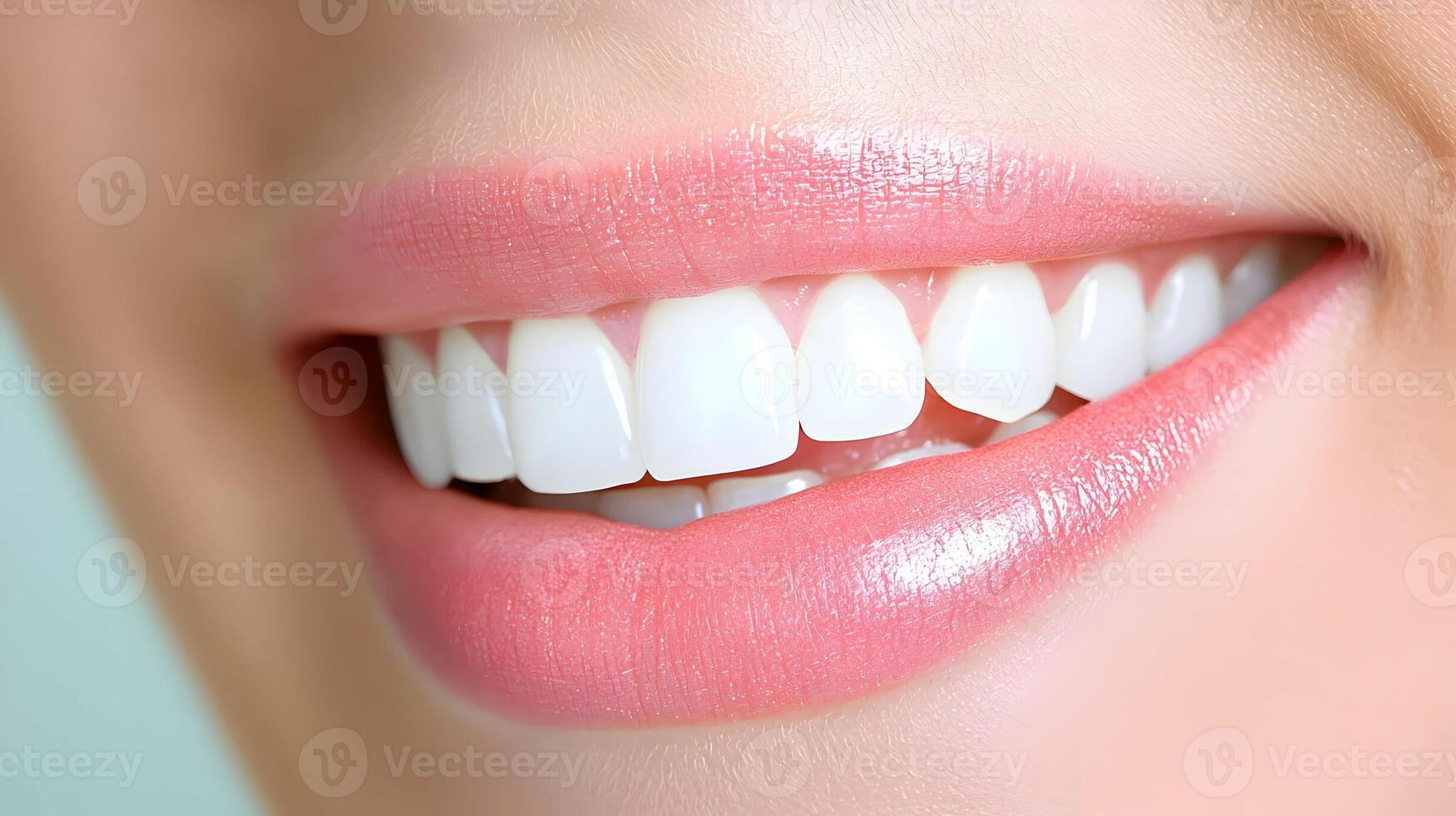 Close-Up of a Woman's Smiling Mouth with Healthy White Teeth photo