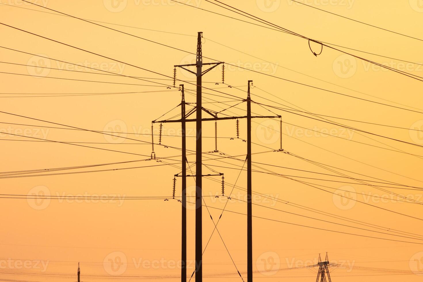 Electricity Pylons Standing Tall Against a Bright Sky photo