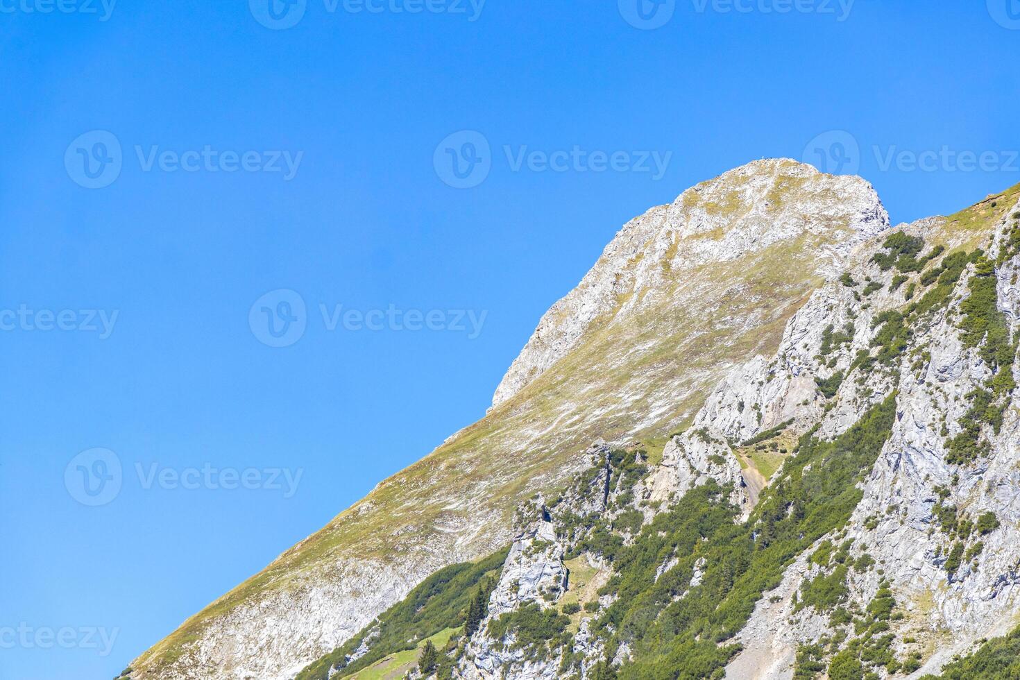 Alpine mountain rocks hills landscape panorama and blue sky Tyrol Austria. photo