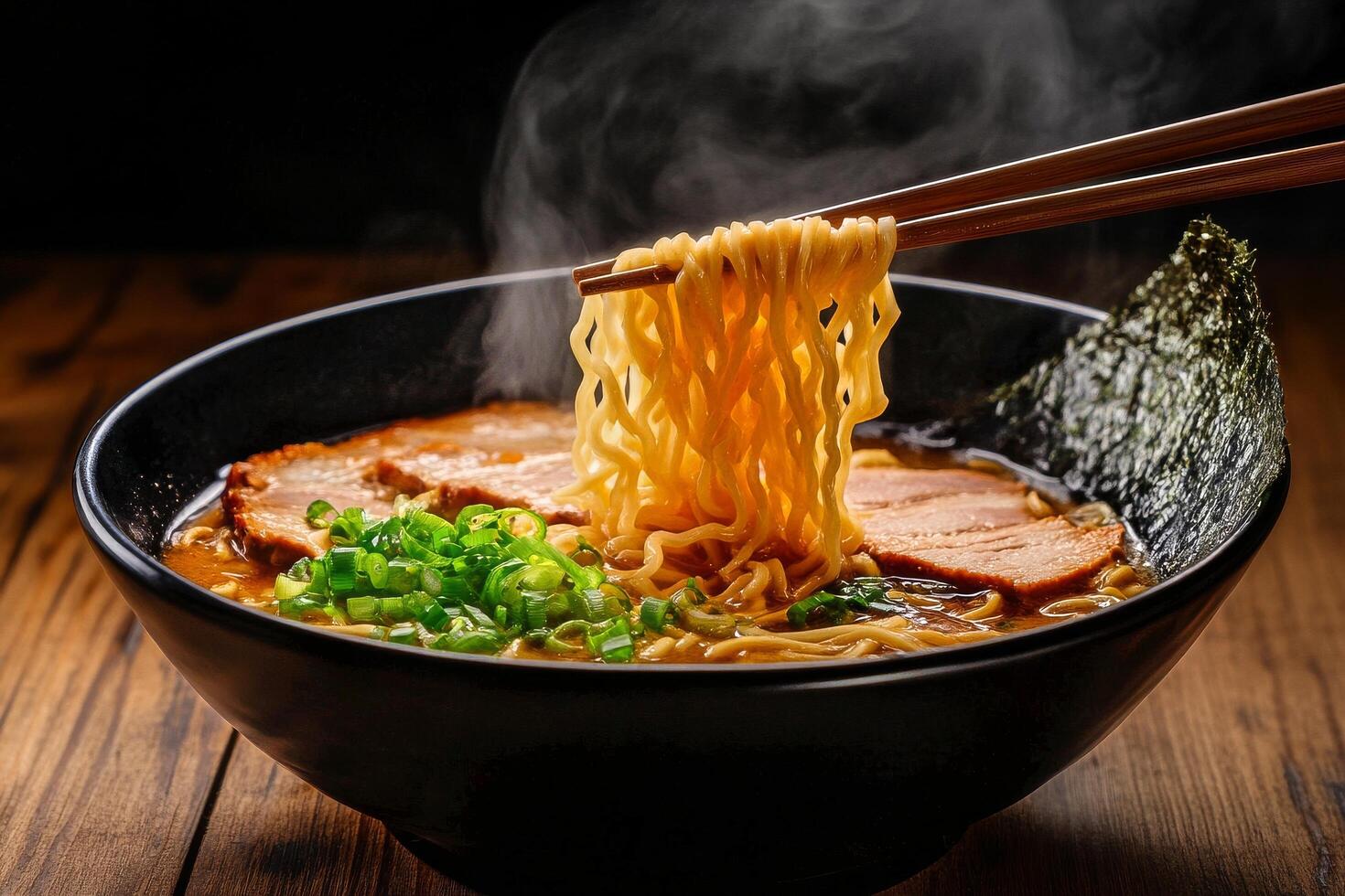 Delicious Ramen Noodles Served in a Black Bowl With Steam and Fresh Toppings at a Cozy Restaurant photo