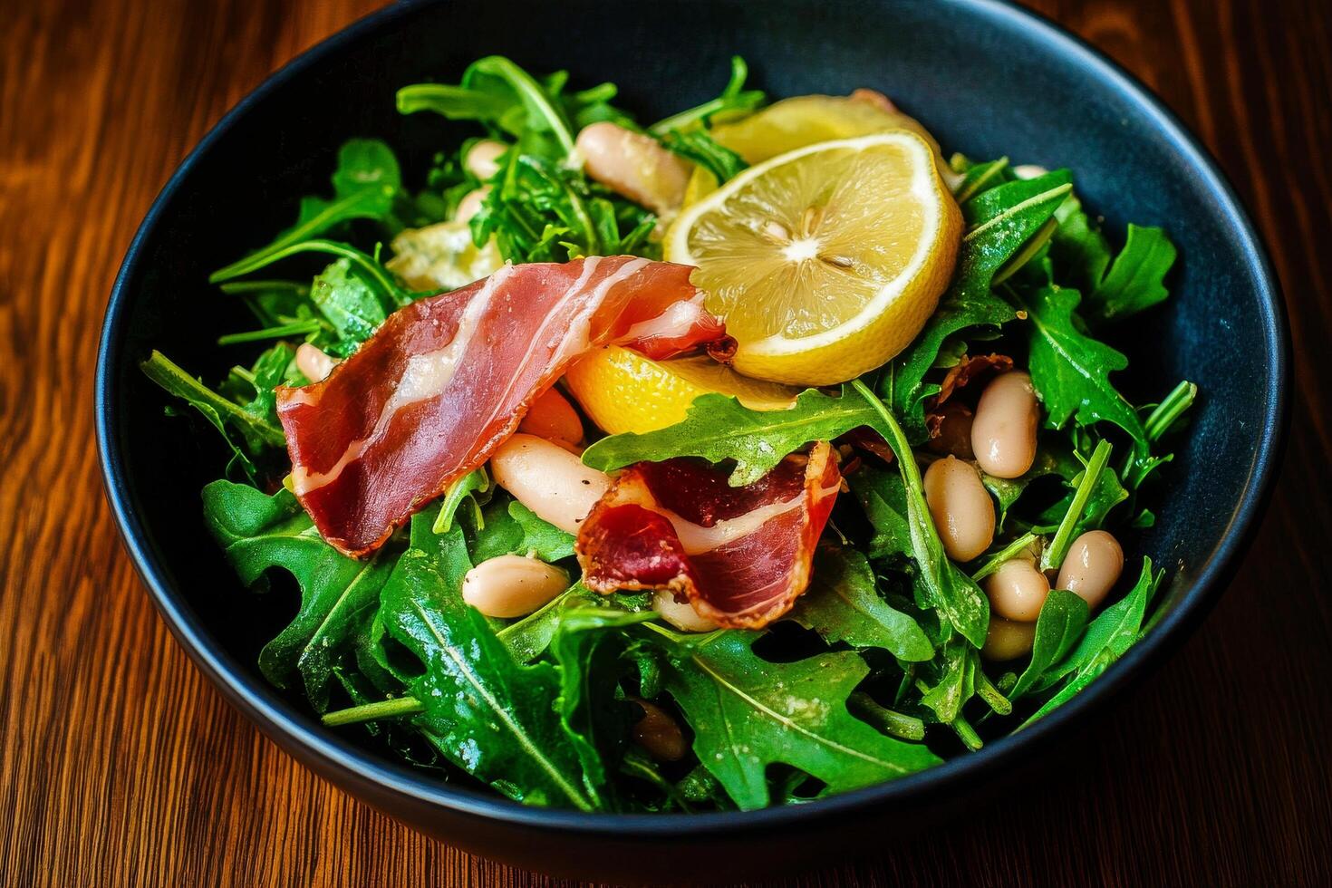 Fresh Arugula Salad With Lemon and Prosciutto on a Wooden Table photo