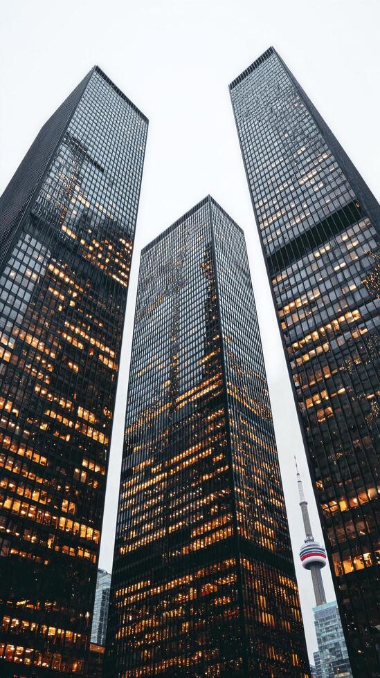 City Skyline View With Illuminated Buildings and CN Tower in Toronto During Evening Twilight. photo
