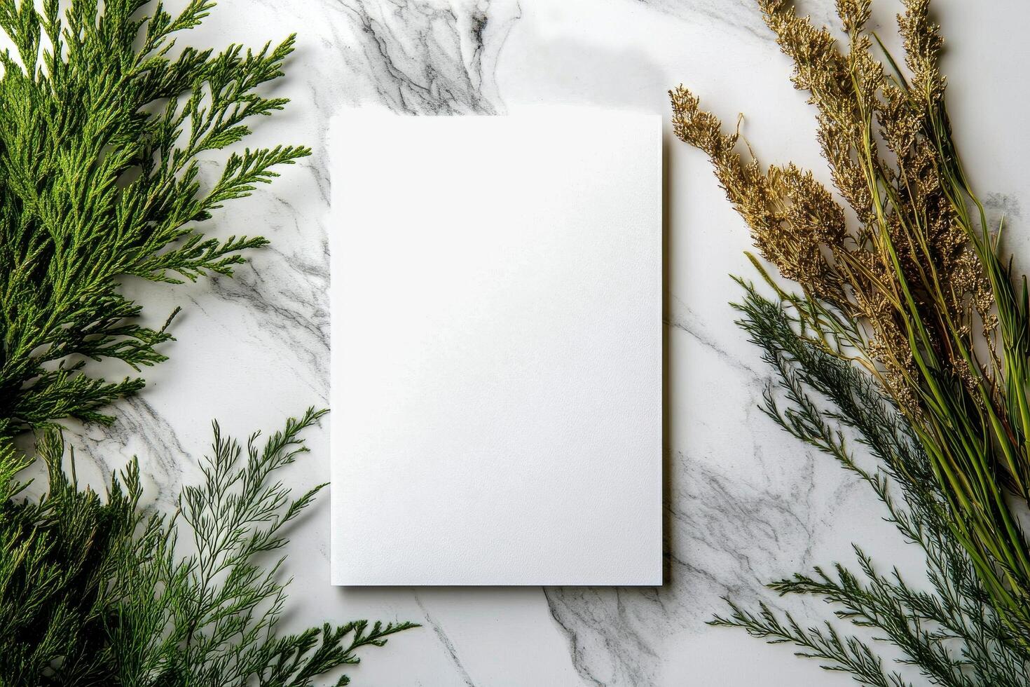 Fresh Greenery Placed in a Wooden Vase Beside a Blank Sheet of Paper on a Marble Surface. photo