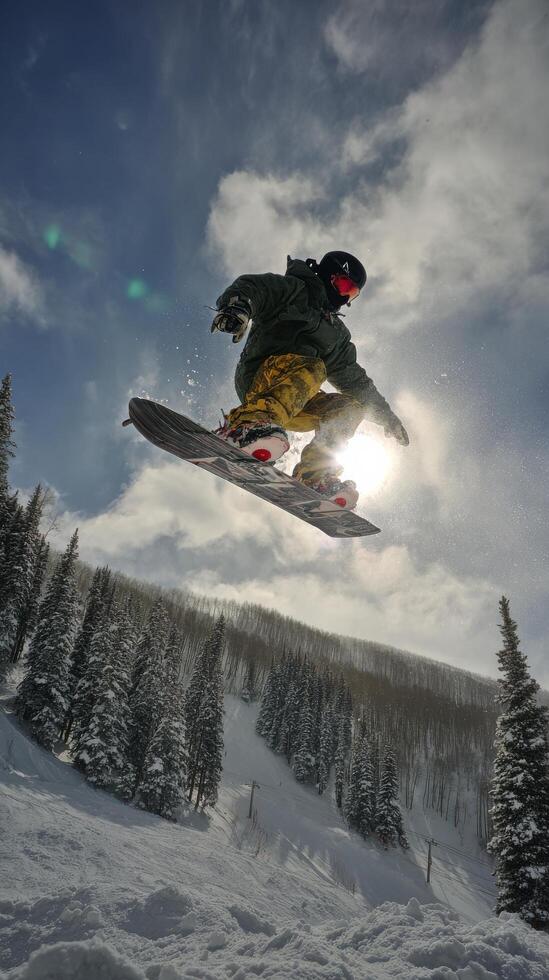 Snowboarder Performs Aerial Trick in Winter Landscape Under Clear Skies. photo