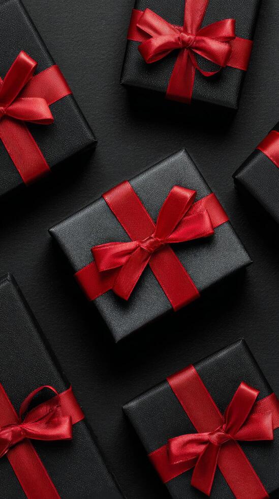Elegant Black and Red Gift Boxes Arranged Neatly on Dark Surface for Special Occasion. photo