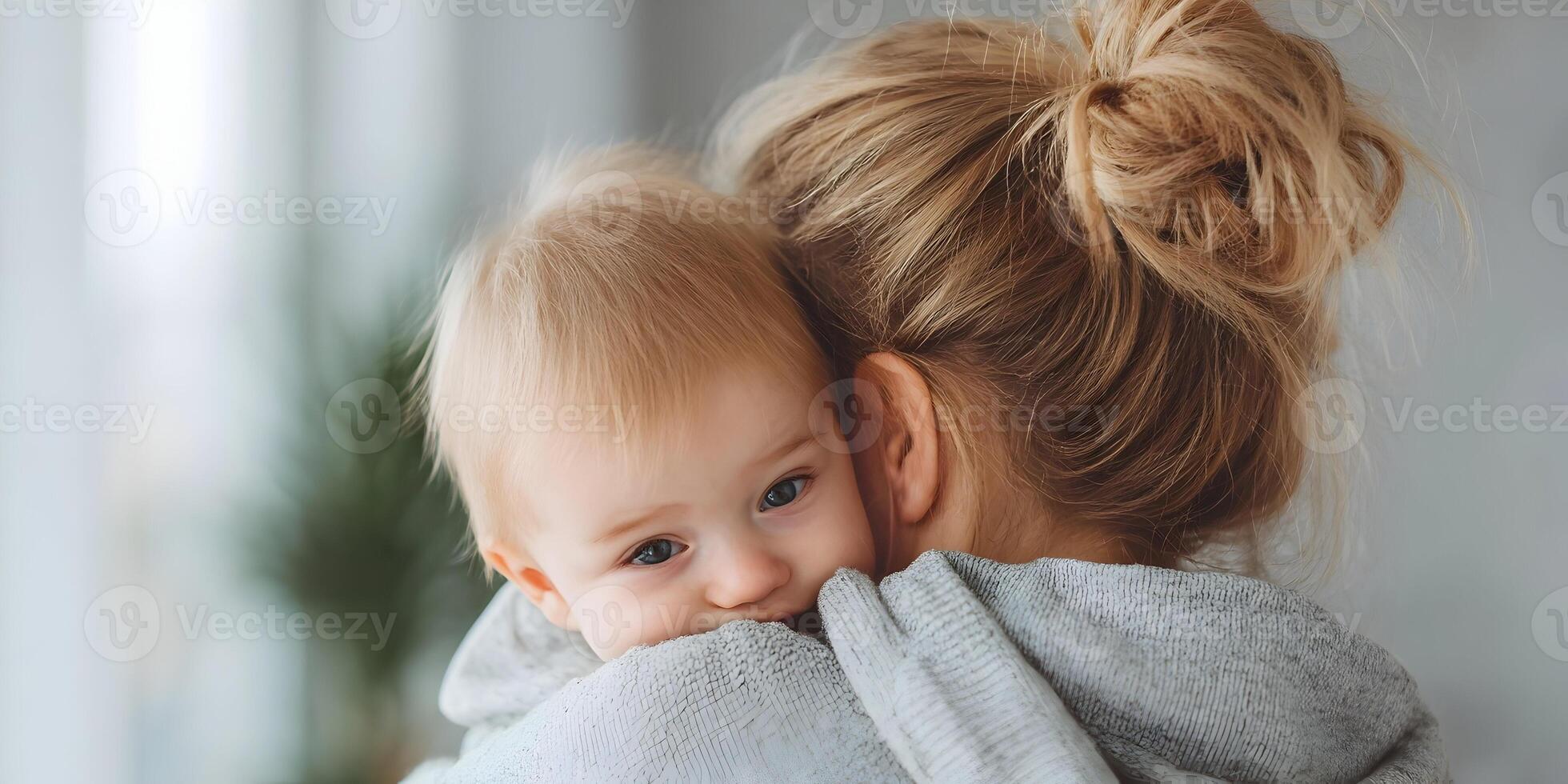 Mother Holding Baby Close Affectionate Embrace Child Care photo