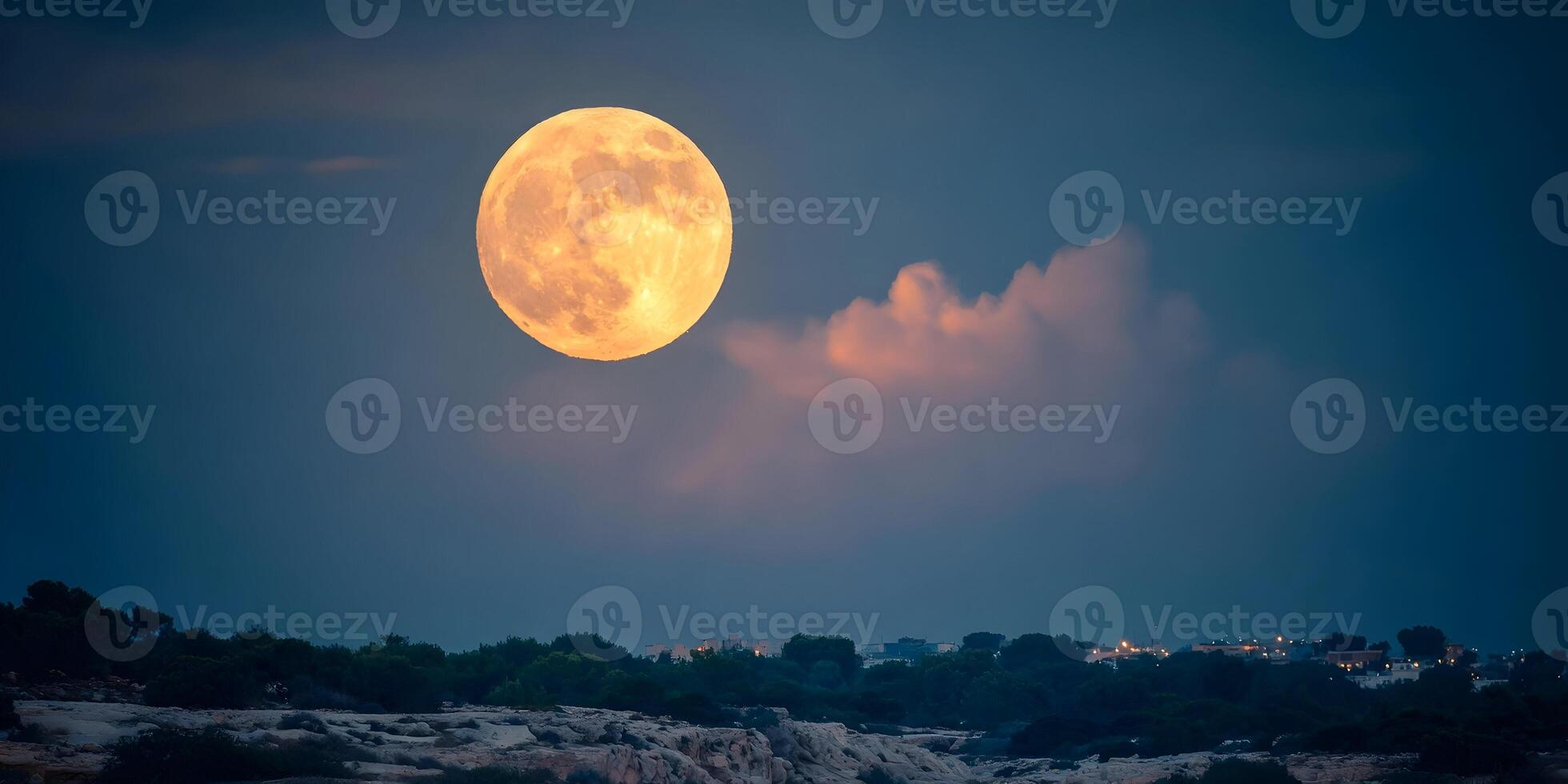Large Full Moon over Dark Silhouette of Town at Night photo