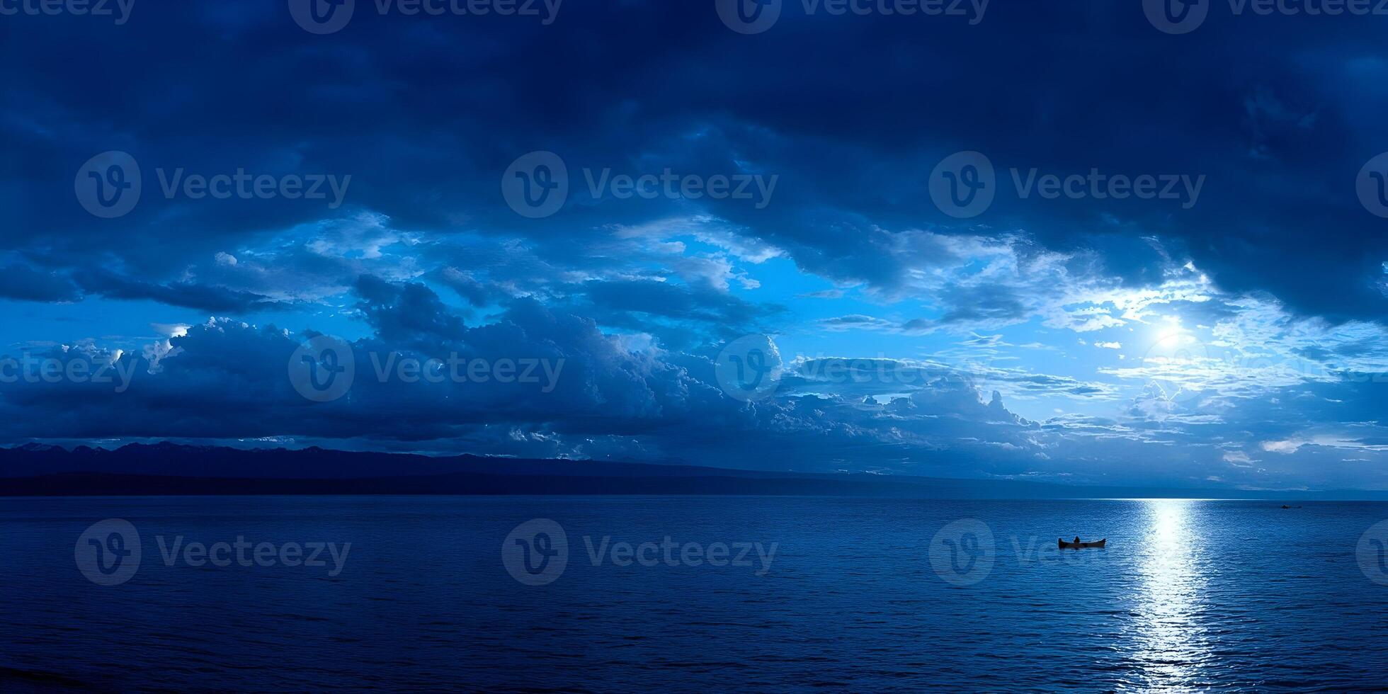 Solitary Boat on Calm Blue Lake Under Dramatic Sky at Sunset Mountains in Background photo