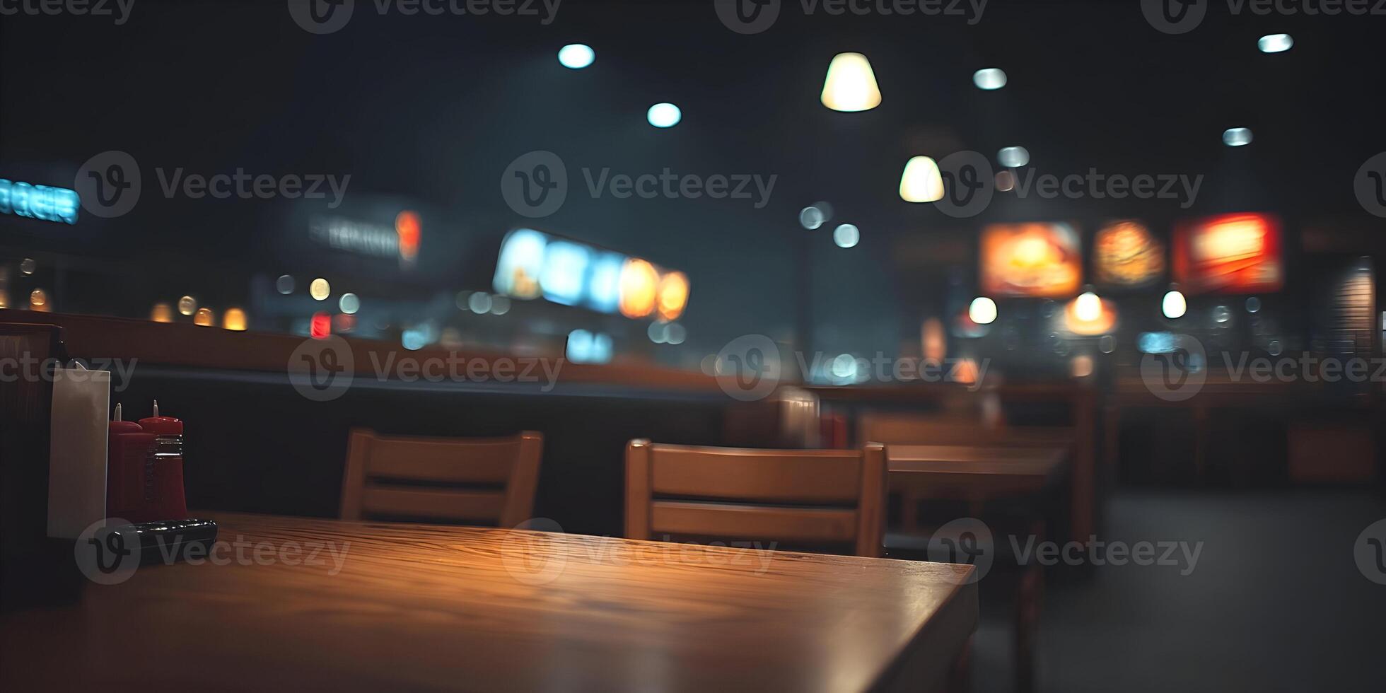 Empty Restaurant Table Nighttime Blurry Background Wooden Chairs Food Menu Boards photo