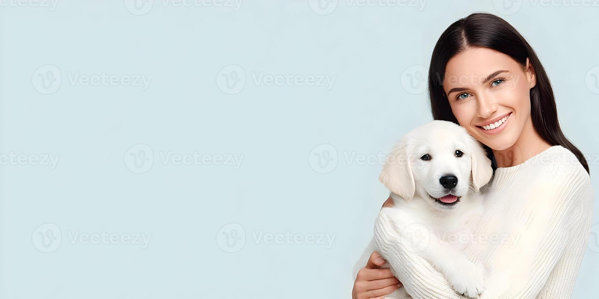 Woman Holding Adorable Golden Retriever Puppy Soft Light Background photo